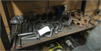Contents of shelf that includes lathe chuck