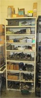 9 Tier metal shelf with contents that includes