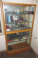 Display case with contents that include plastic