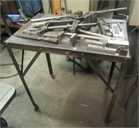 Metal rolling shop stand with contents that