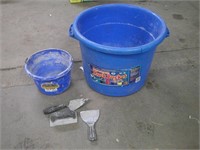 2 blue buckets and masonry hand tools
