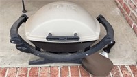 Small Weber 140 Electric Grill With Handles.
