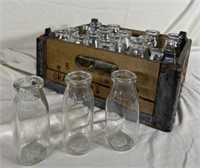 Graveman’s dairy wooden crate with milk, glass