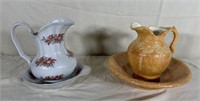 Two ceramic water, pitchers, and their bases