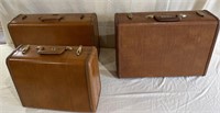 Three vintage Samsonite suitcases