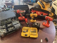 Three cordless drills and fasteners