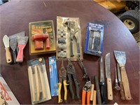 Assortment of knives and new in box tools