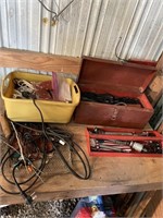 Metal tool box and assortment of power cords