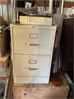 Two drawyer filing cabinet and items inside