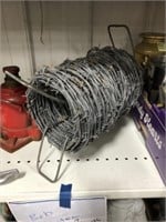 PARTIAL ROLL OF BARBED WIRE