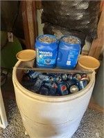 50 gallon barrel full of cans and two tubs of