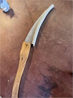 Serrated blade knife with wooden handle