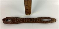 Cast iron bottle opener with the word garland on
