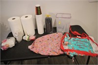 Aprons, paper towels, coffee cups with lids
