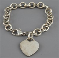 Sterling charm bracelet with heart charm 1.09ozt