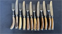 12 antler handle knives and forks, six matching