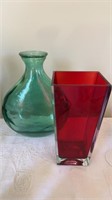 Two large glass flower vases, one clear cased