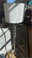 5 ft modern stainless steel, floor lamp, with a