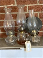 THREE GLASS KEROSENE LANTERNS