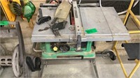 Hitachi table saw & accessories, on stand
