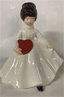 CERAMIC LADY WITH RED HEART. SOME CHIPS