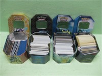 Four Pokemon Tins With Assorted Cards