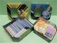 Two Pokemon Tins With Assorted Cards