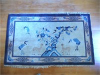 Oriental area rug with fawns and birds