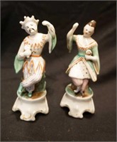 Pair of hand painted figurines of Asian man and