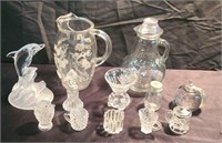 Assorted glass pitchers,  vases, and decorations.