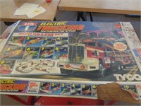 1980'S TYCO ELEC TRUCKING W 2 SLOT TRUCKS