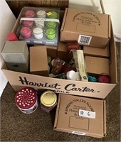 Large box of new scented candles, candleholders