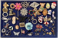 Costume jewelry brooches and rings