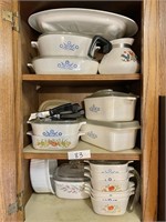 Upper cabinet filled with Corning Ware