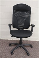 Adjustable office chair on casters