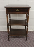 Two shelf, one drawer side table on decorative