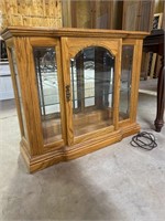 Mirrored, lighted, wooden display cabinet