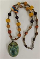 Beaded necklace with large scarab pendant