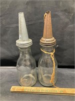 2 vintage oil bottles