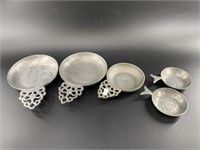 Assorted pewter spoon rests