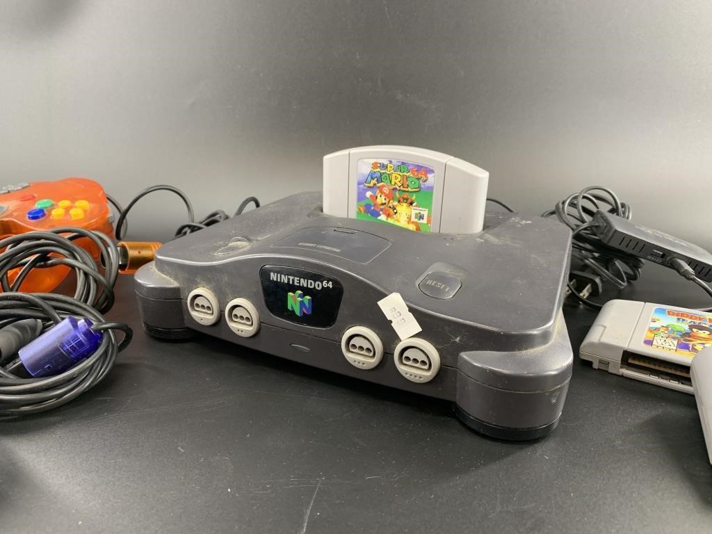 Nintendo 64 gaming system with cartridges, 4 contr