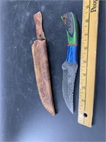 Damascus bladed knife with wood scales and beautif