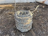 Partial roll of barbed wire