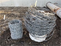 Partial roll of barbed wire & bucket