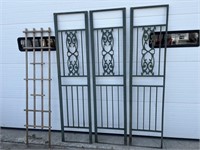 3 green metal trellis and one wood trellis