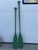 2 green wood paddles