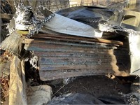 Sheets of OSB board been under tarp sold as found