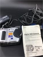 Sony FD Mavica camera with cords, literature in a