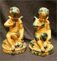 Pair of terracotta angel candle holders