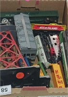 Box of Model Railroad Cars and Accessories